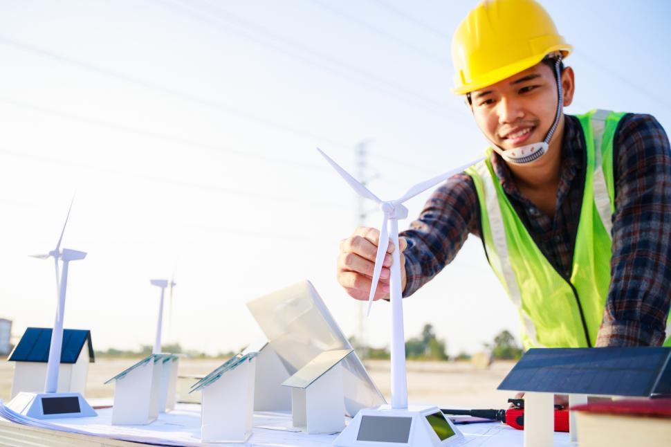 Free Image of Engineer working on wind turbine model project 