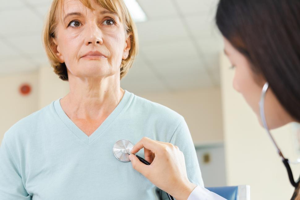 Free Image of Doctor uses a Stethoscope 