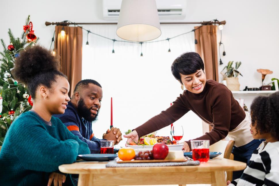 Free Image of Merry Christmas. Happy family are having holiday dinner together. 