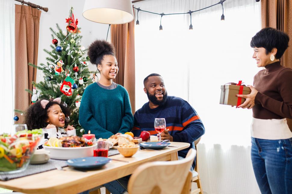 Free Image of Christmas family gift giving 
