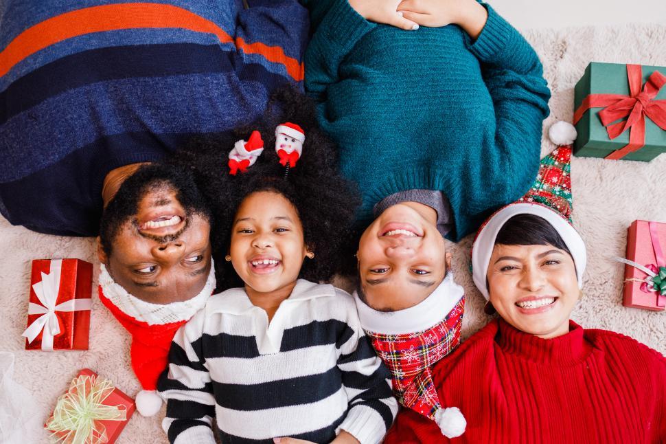 Free Image of Happy holiday family giggle on the floor 