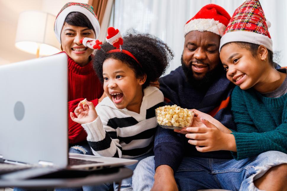 Free Image of Child and family enjoying content on laptop screen or video call 