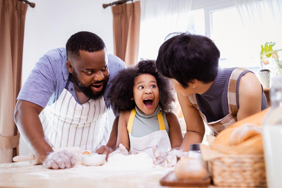 Free Image of Little girl is excited about baking progress 