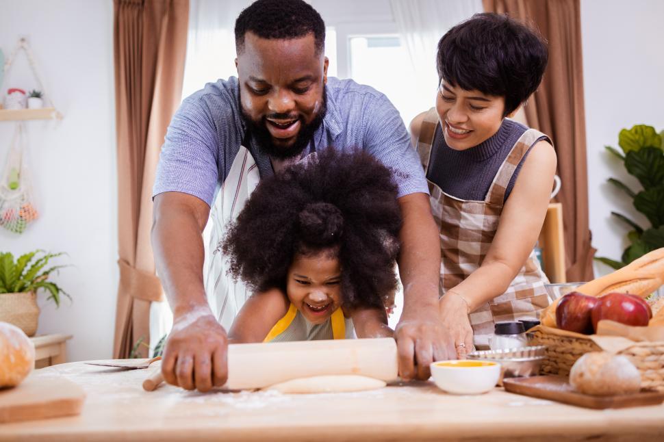 Free Image of Family rolling cookie dough 
