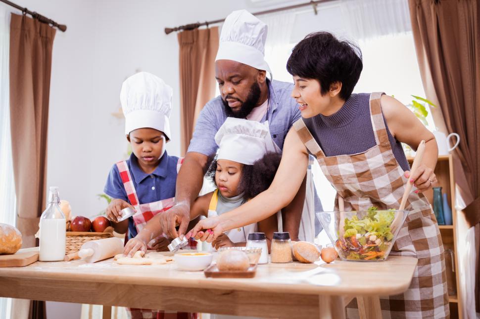 Free Image of Young family cooking together 