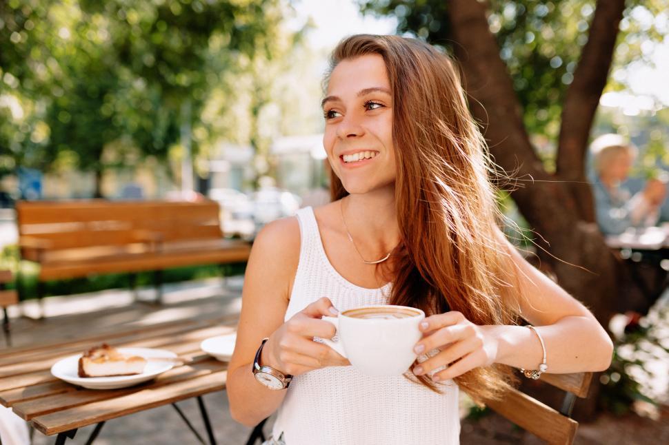 Free Image of Close-up outside portrait of happy young lady 