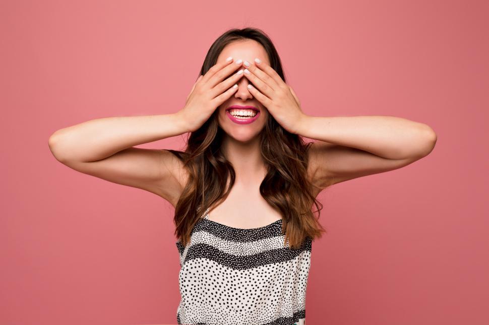 Free Image of Excited pretty woman with long wavy hairstyle 