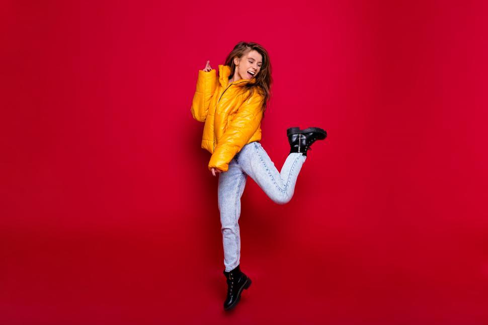 Free Image of Full-length portrait of active happy girl with long 