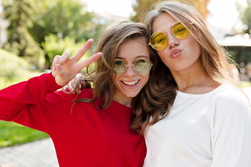 Free Image of Outside portrait of two best friends having fun together 