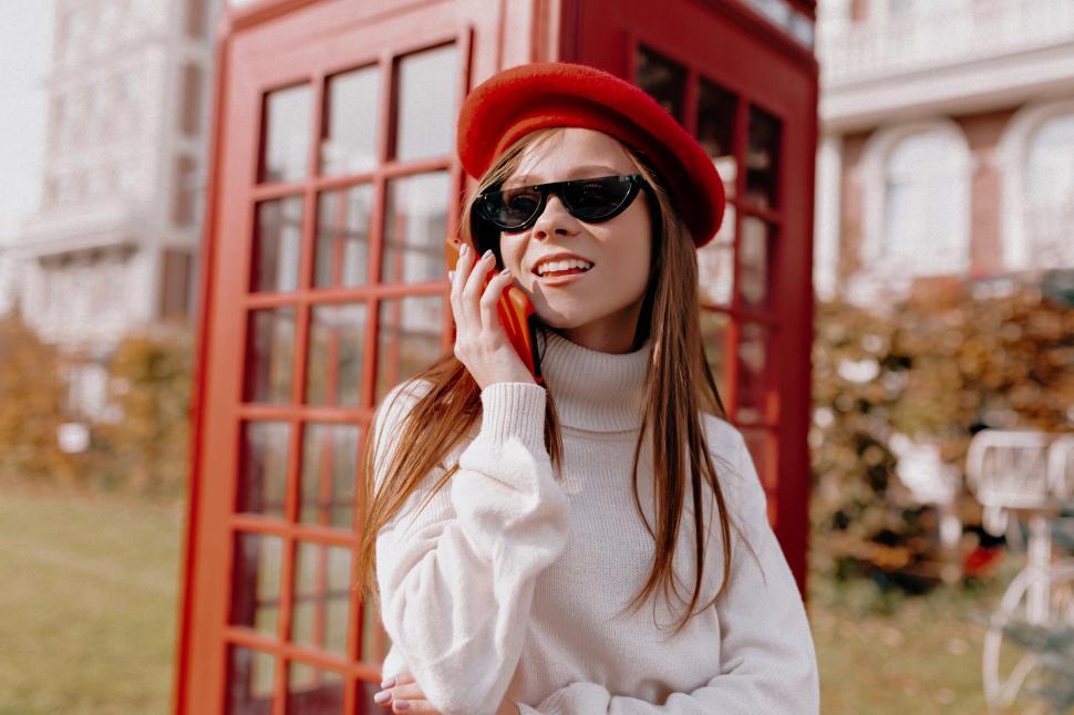 Free Image of Adorable lady with long hair wearing red cap and black glasses 