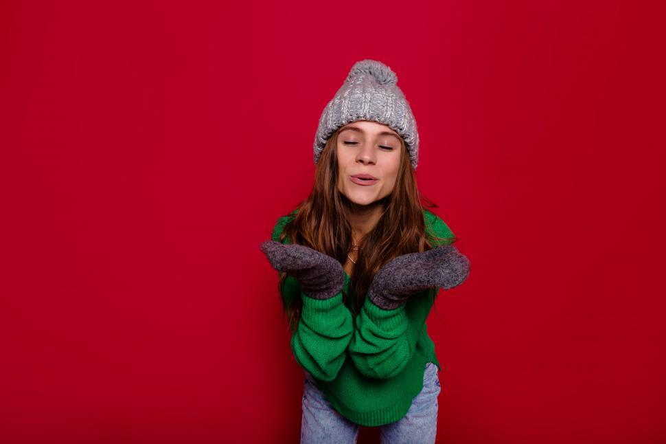 Free Image of Portrait  of charming girl with long hair on red background 