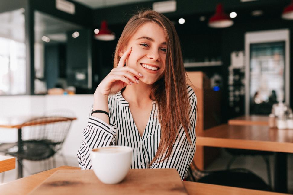 Free Image of Adorable charming lady with long hair wearing trendy blouse 