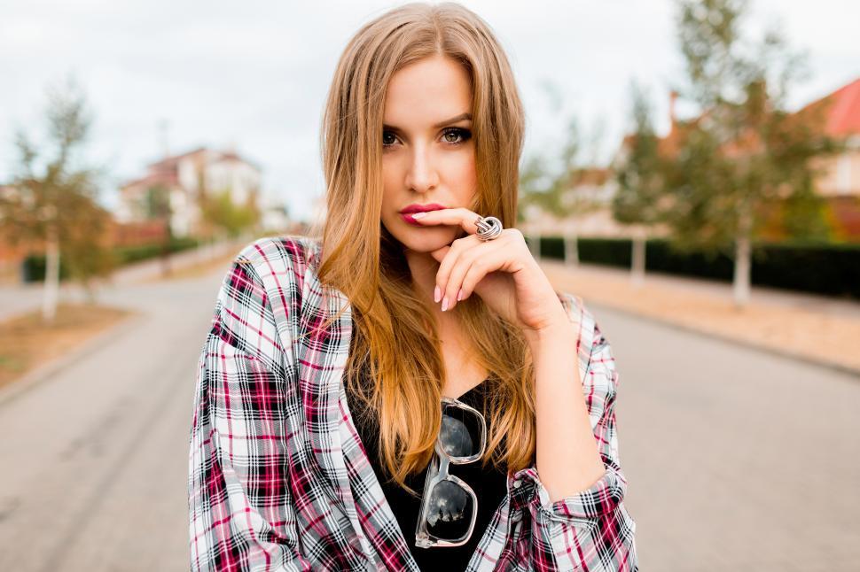 Free Image of Woman looking at camera, posing in neighborhood 