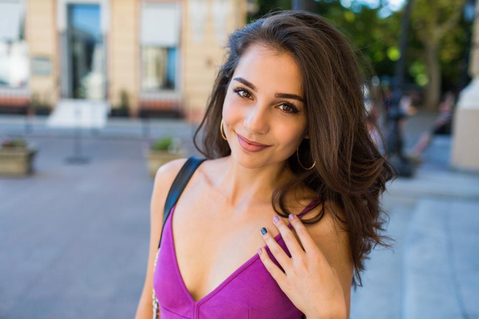 Free Image of Portrait of happy  brunette woman  in stylish dress. Cheerful young girl having fun 