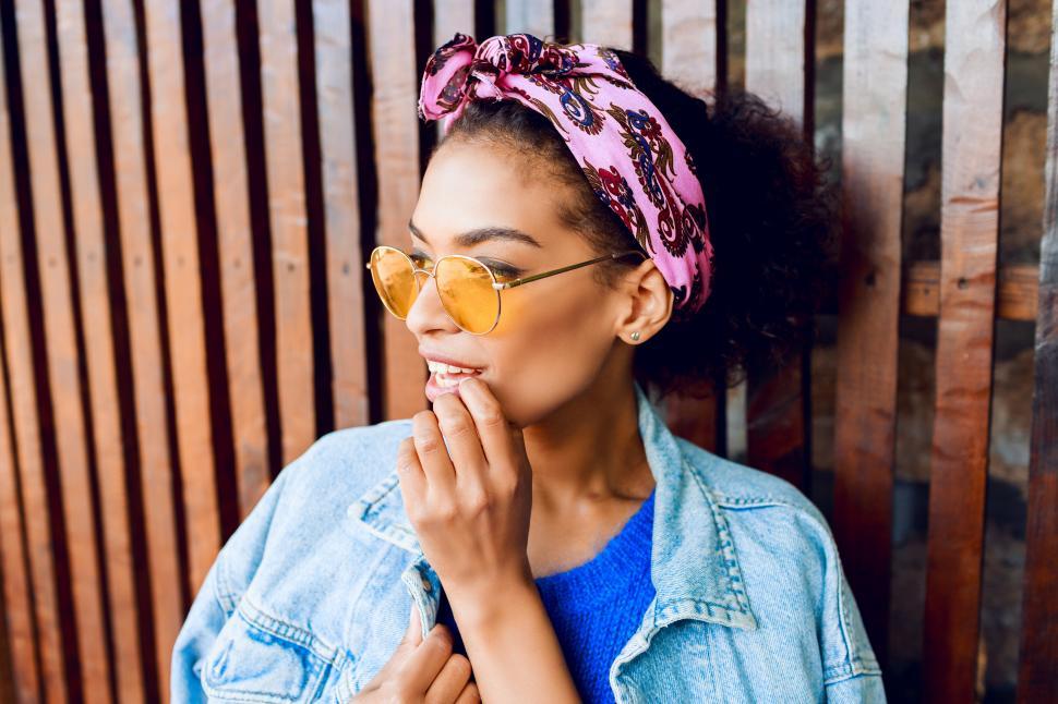 Free Image of Young woman with stylish hair posing outdoor 