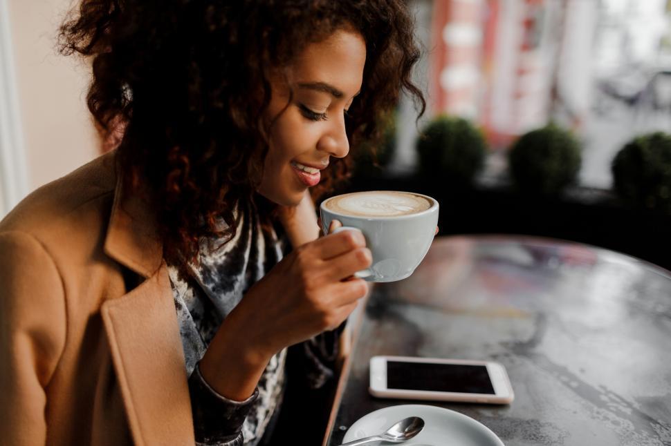 Free Image of Woman checking her news feed or messaging via social networks 