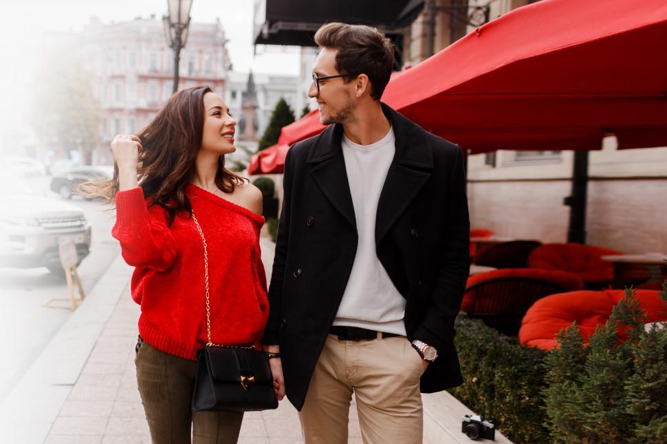 Free Image of Elegant couple walking in city 