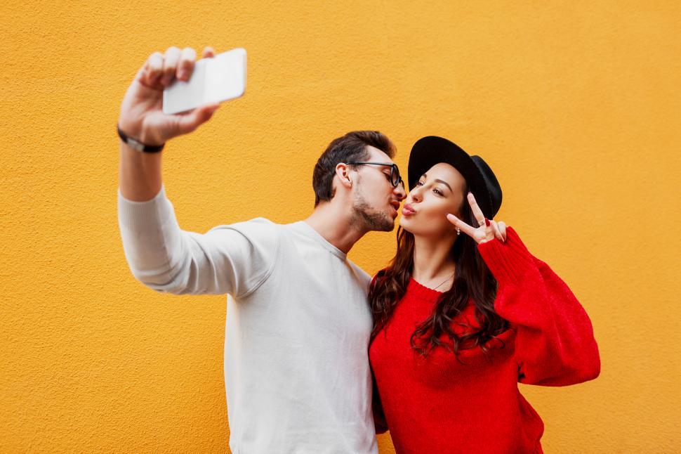 Free Image of Happy girl with her boyfriend making self portrait 