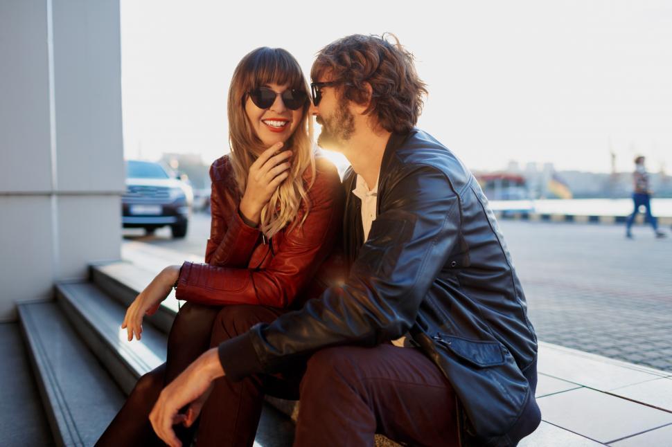 Free Image of Couple in love sitting on the steps 