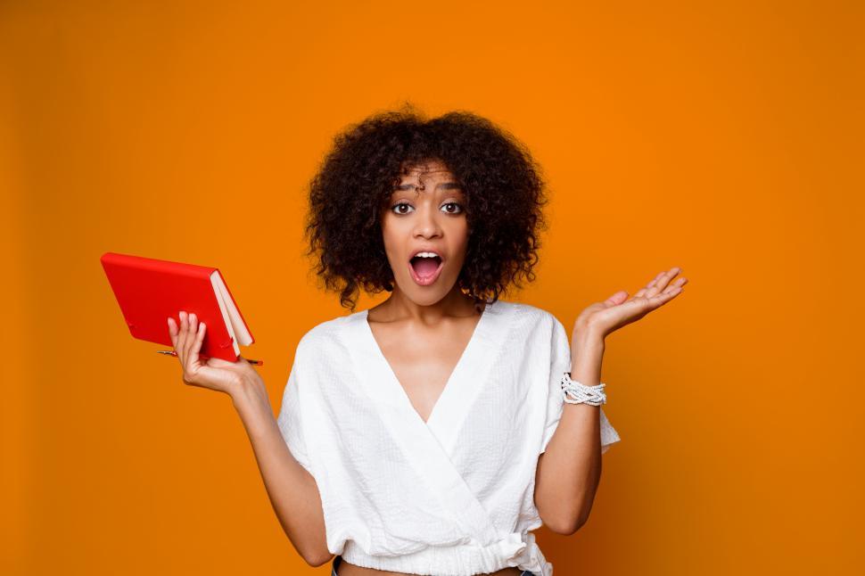 Free Image of Pensive student female with book 