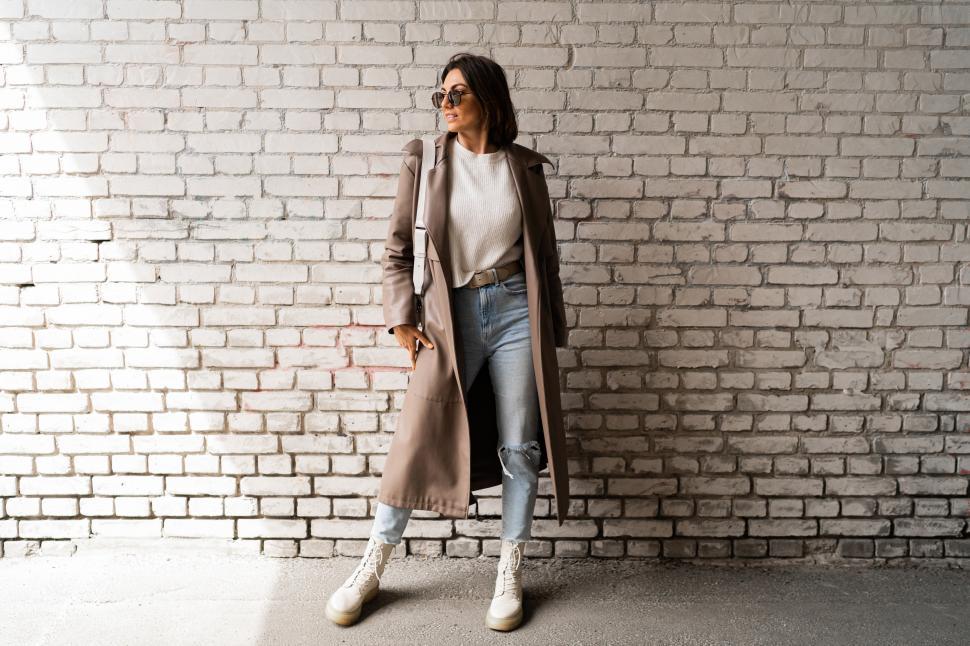Free Image of Stylish short haired woman in casual leather coat and jeans 
