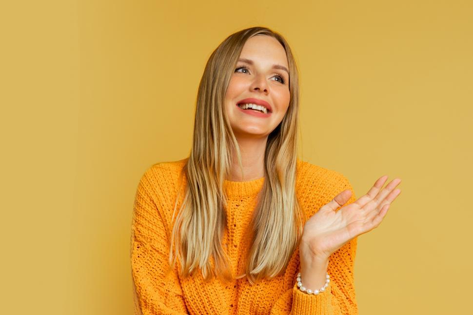 Free Image of Blond woman in orange stylish autumn sweater 