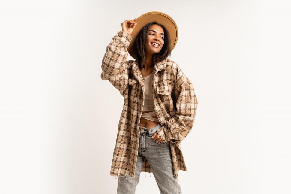 Free Image of Woman in jacket, wool hat and leather boots 
