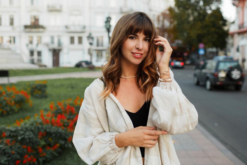 Free Image of Girl in casual clothes walking around the city center 