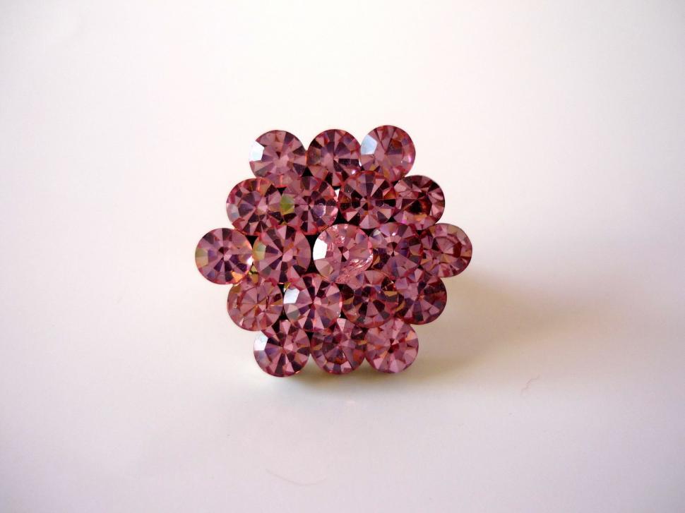 Free Image of Close Up of a Pink Diamond on White Surface 