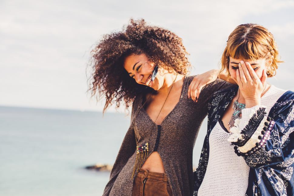 Free Image of a couple of two girlfriends in the shore in autumn 