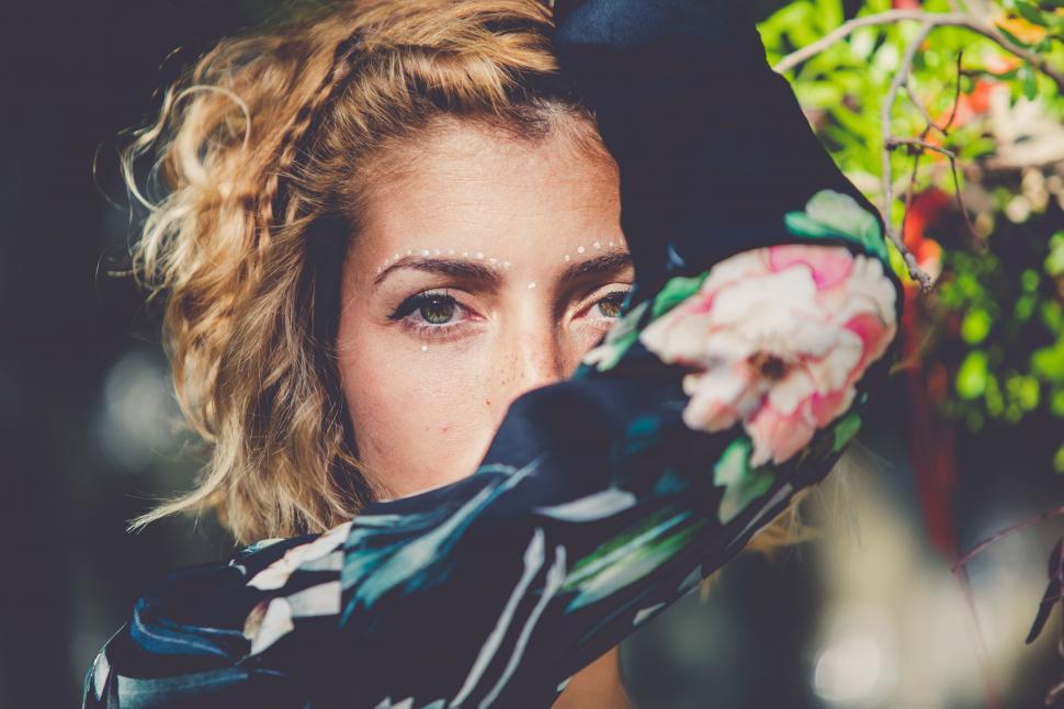 Free Image of a young blonde boho model in a natural background 