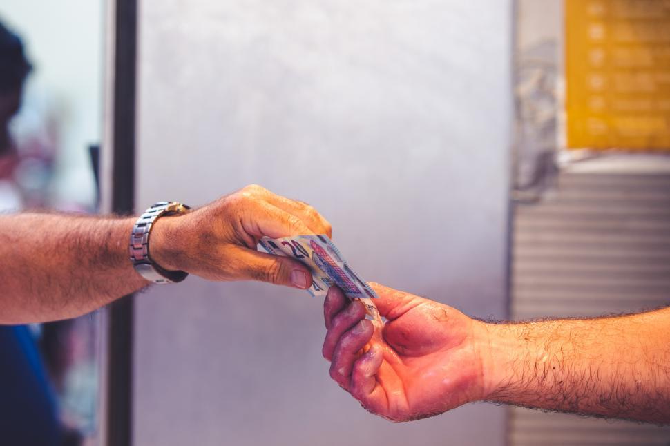 Free Image of hands close up paying with cash 
