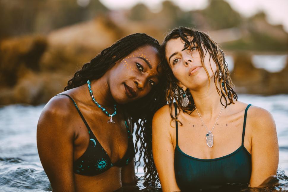 Free Image of Affectionate women in bathing suits  