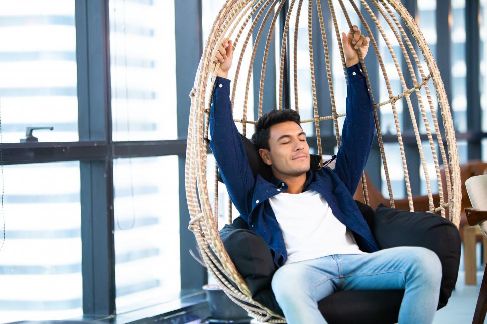 Free Image of Businessman relaxing in his desk at office 