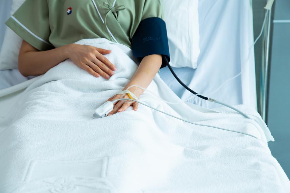 Free Image of Hands woman patient in hospital bed 