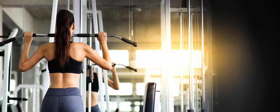 Free Image of Woman using an exercise machine 