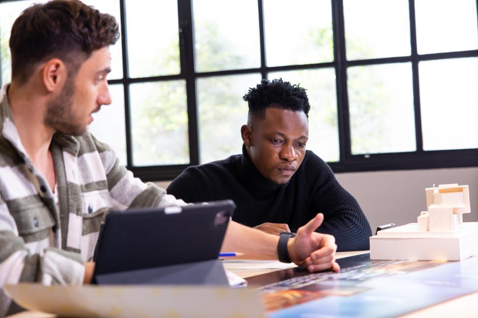 Free Image of Architects discuss project 