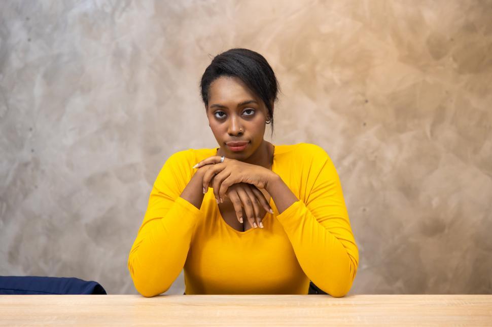 Free Image of Young african american businesswoman at table 