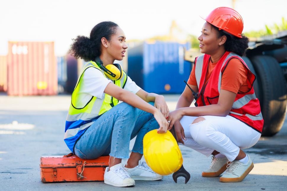 Free Image of Two female mechanics working in car service 