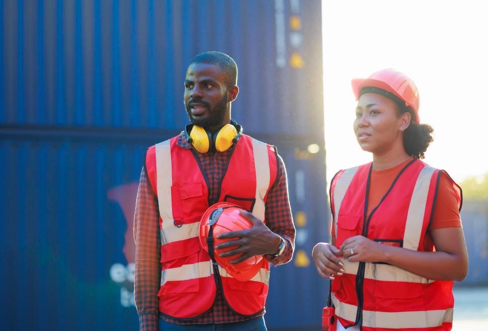 Free Image of Portrait or male and female coworkers in safety gear 