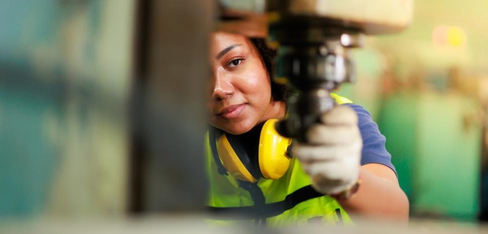 Free Image of Woman working lathe machine 