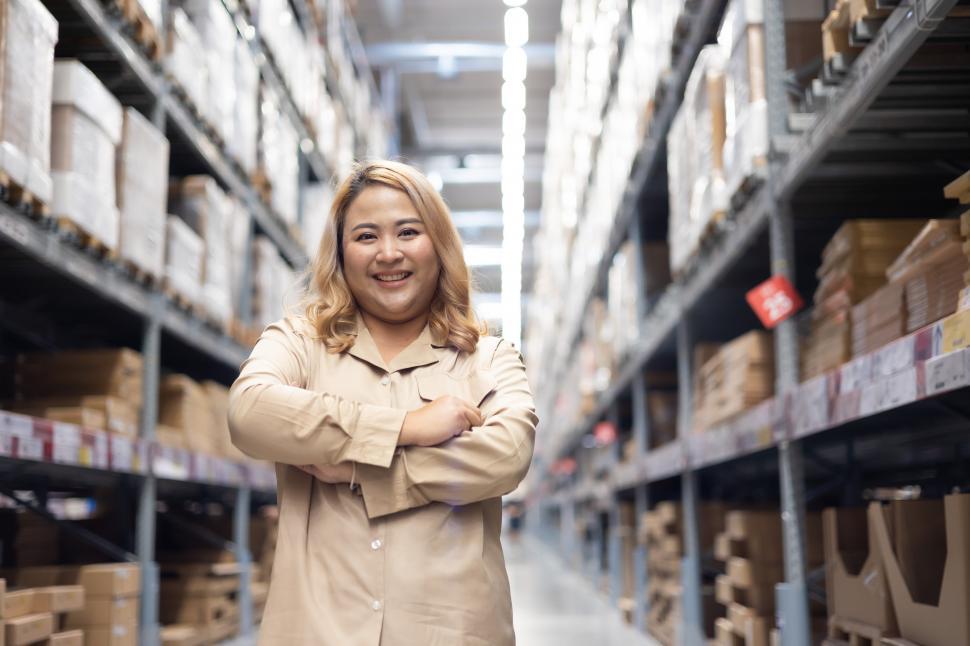 Free Image of Portrait of female worker looking at camera while working 