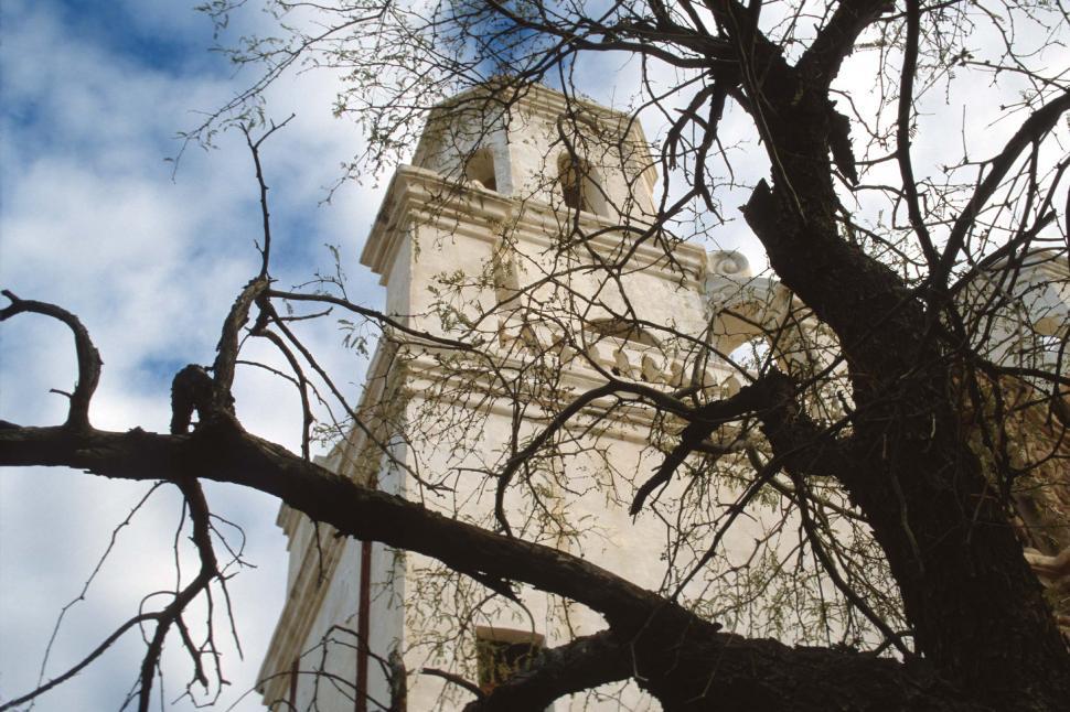 Free Image of San Xavier through the trees 