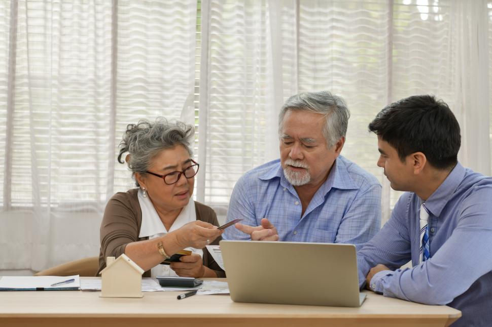 Free Image of Couple discussing financial plans with financial advisor 