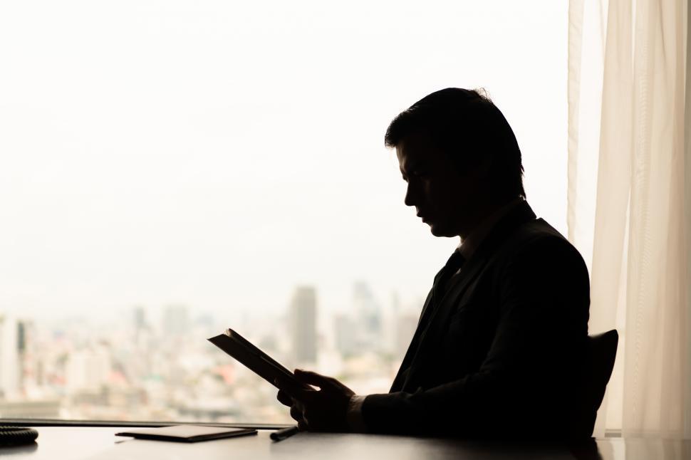 Free Image of Silhouette of young businessman in office 