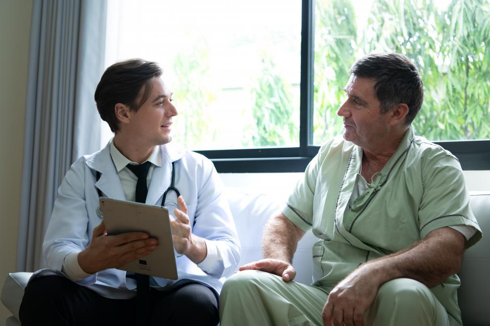 Free Image of A young doctor who specializes in heart disease advising patient. 