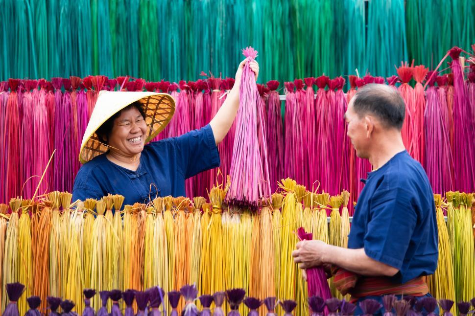 Free Image of Processing flax trees into colorful weaving material 