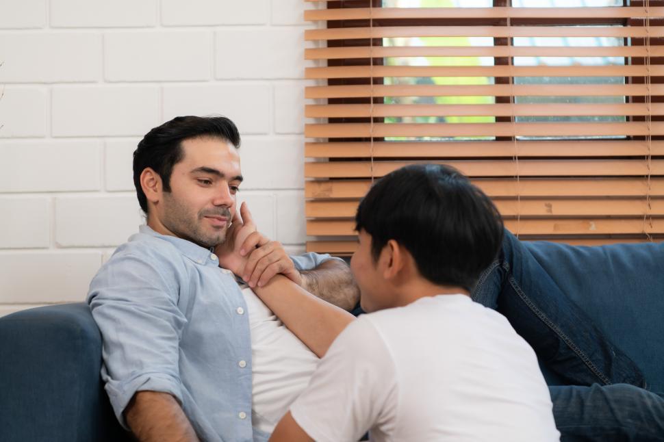 Free Image of Two men share a tender moment together 