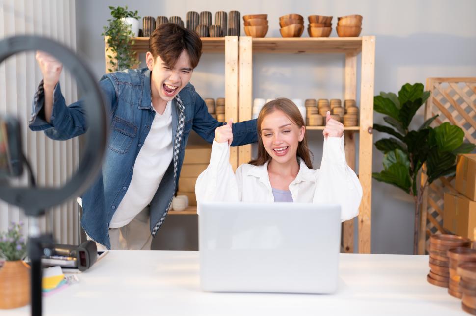 Free Image of A young couple runs a small business making clay ornaments, celebrate online success 