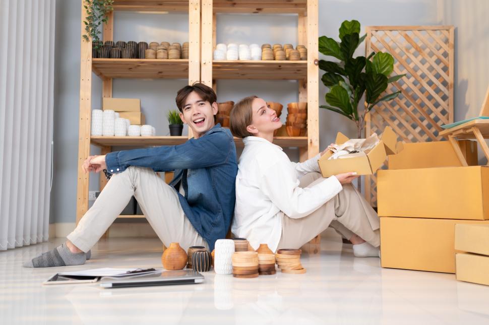 Free Image of Small business owners make clay accessories sitting in shop 